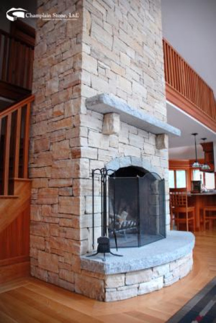 Natural Stone Around An Indoor Fireplace